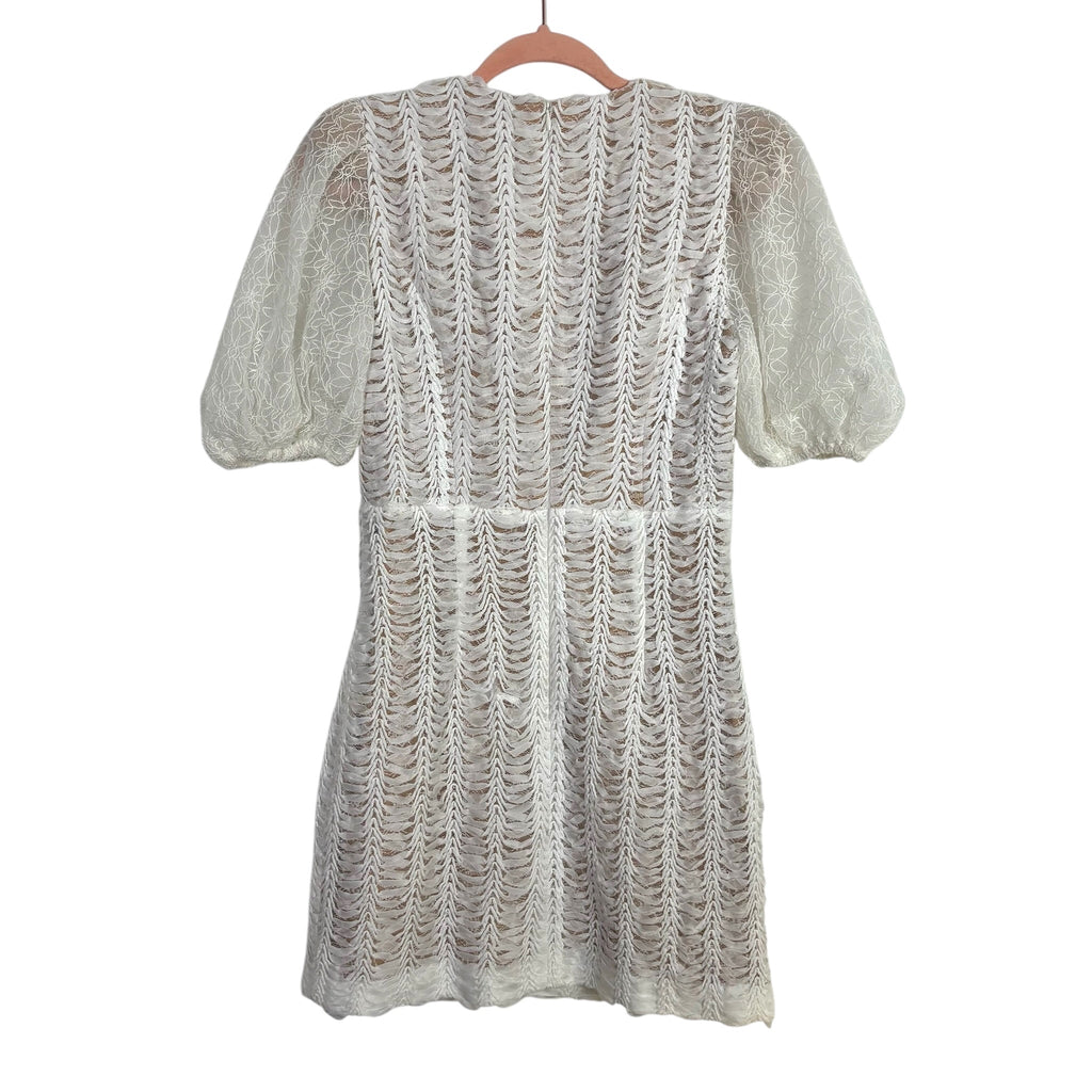 elliat white dress Elliatt Darcy Puff Shoulder Gown in while the asymmetrical skirt adds a dynamic Elliatt Yvette Ruffle Mini Dress