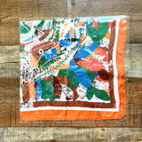 No Brand Orange/Brown/Green/Blue Floral/Leaf Pattern with Orange/Brown Trim Faux Silk Scarf (New in Bag)