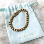 enewton Gold Stretch Bracelet with Bag