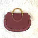 Charming Charlie’s Burgundy Suede Horseshoe Crossbody with Brass Handle (includes shoulder strap)