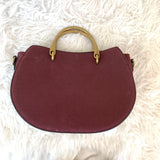 Charming Charlie’s Burgundy Suede Horseshoe Crossbody with Brass Handle (includes shoulder strap)
